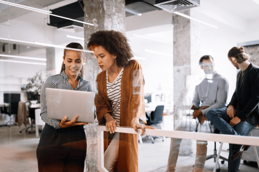Business team collaborating in a modern office, discussing agentic AI systems to enhance employee experience, ensure data sovereignty, and improve operational efficiency.
