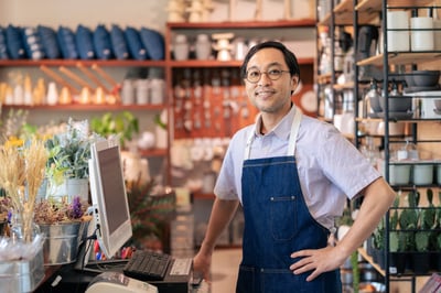 retail man happy due to retail demand planning and forecasting