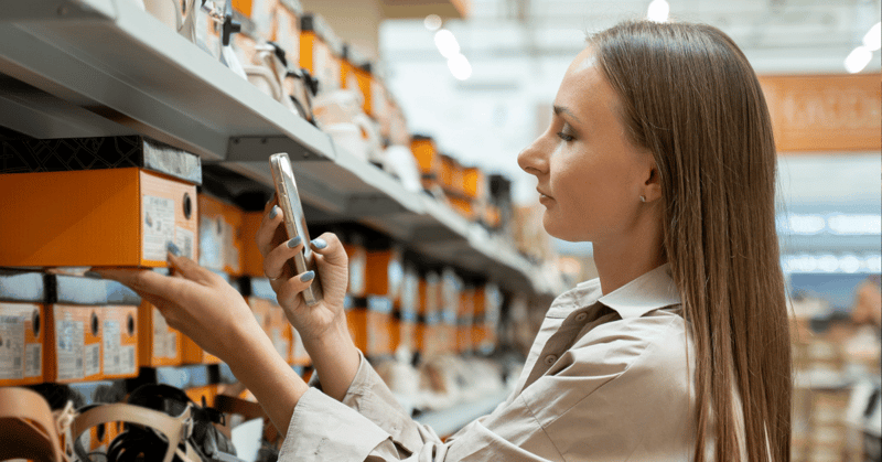 woman engaging in shoe shopping at global footwear company thats well stocked due to ai-powered demand forecasting for retail