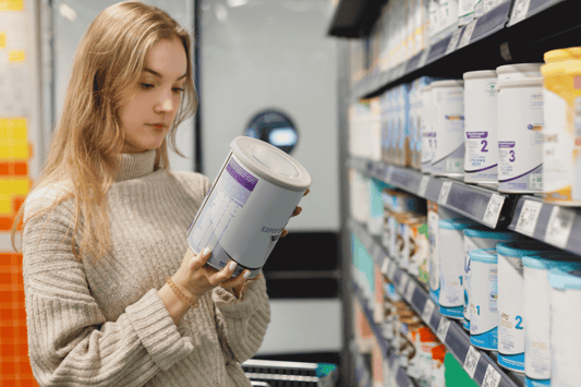 Shopper reviewing item details, representing demand forecasting software powered by sales and historical data.