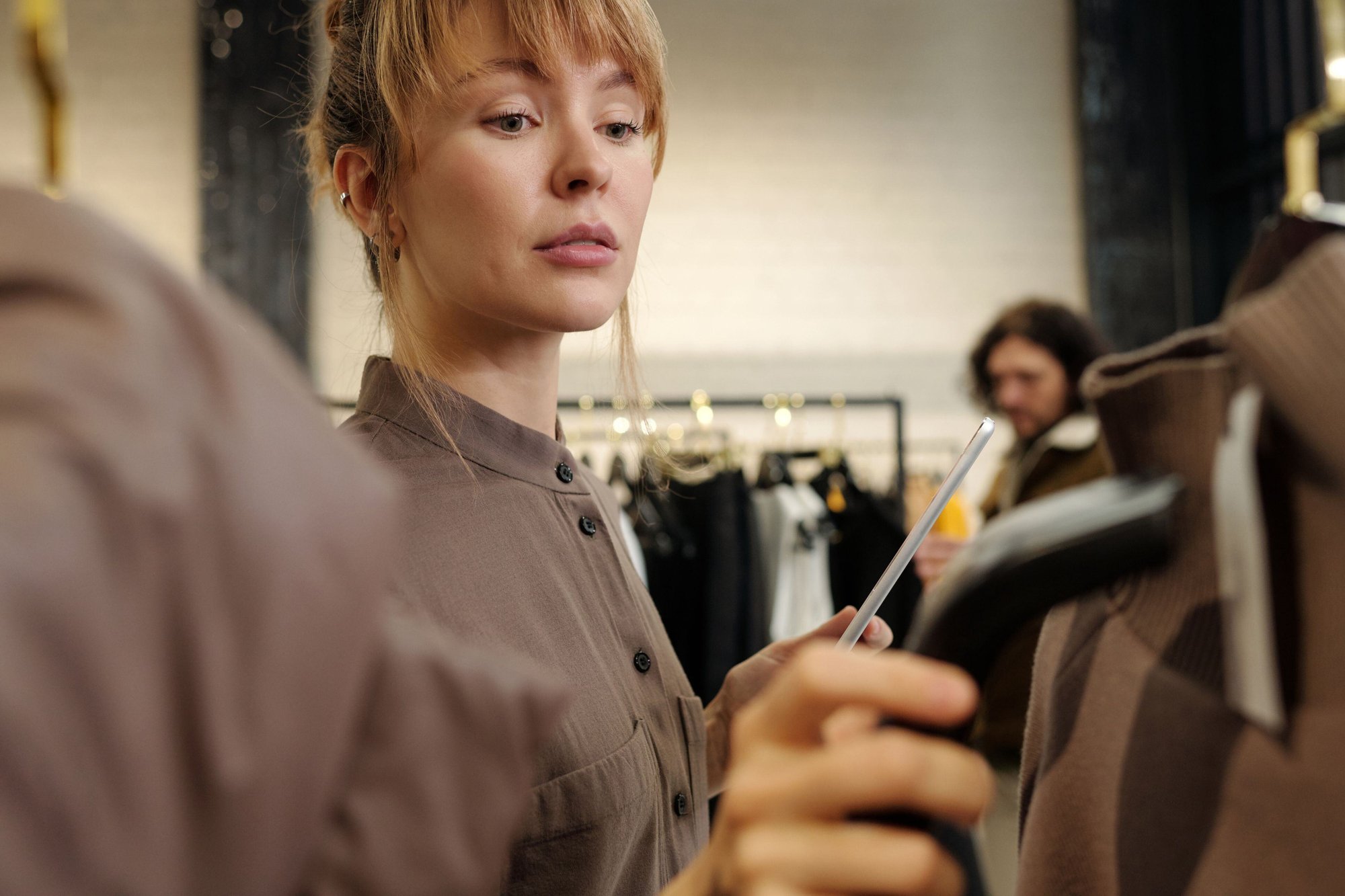 Woman scanning price tag fashion