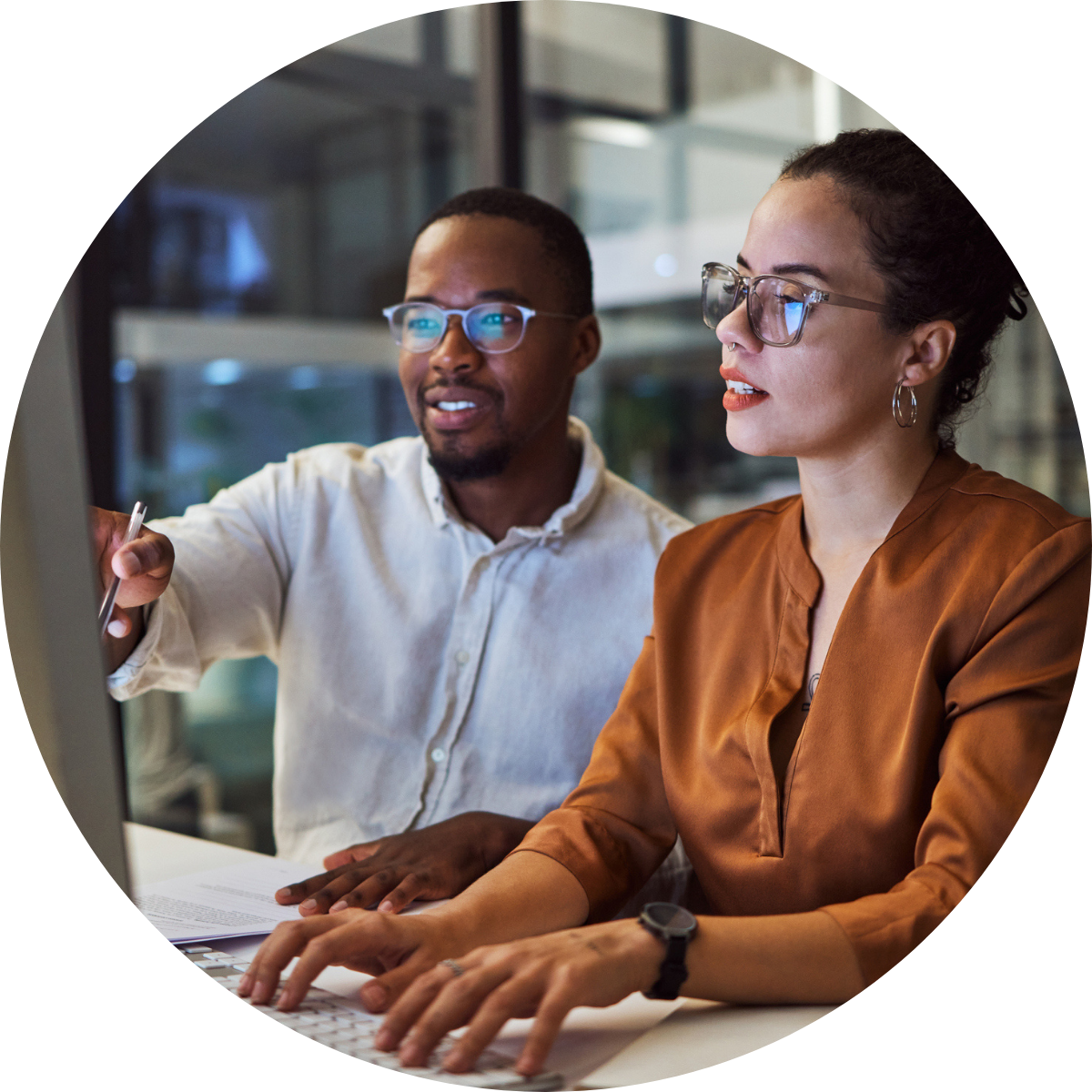 Two people working on retail decisions on computer round