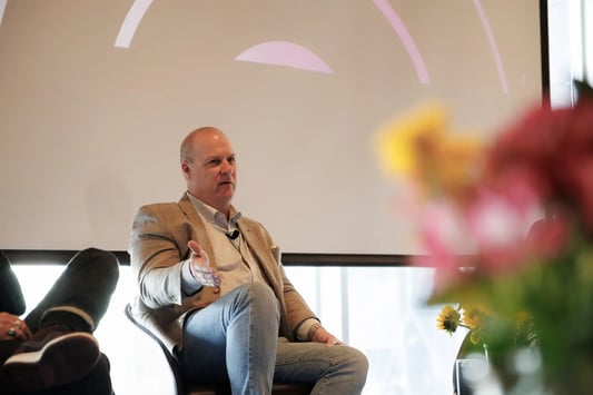 Retail executives from Tailored Brands and Mavi sharing AI in retail success stories on stage at the Reinventing Retail AI Summit.