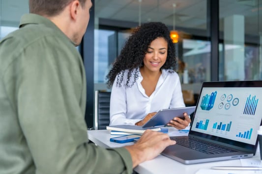 Inventory planners discussing AI implementation roadmap and stakeholder buy-in for inventory optimization.