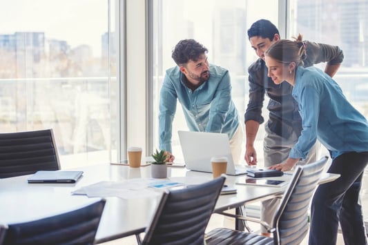 Inventory planners analyzing inventory management workflows and ROI metrics to build an AI business case.