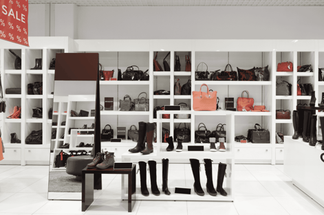 Retail display of handbags and boots showing streamlined retail inventory and effective stock management.