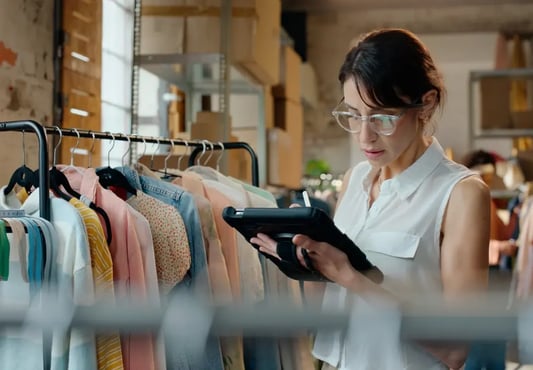 Retail planner using tablet for assortment management and SKU optimization in a clothing warehouse
