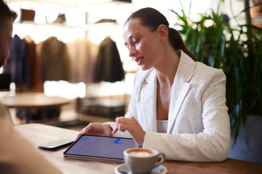 Retail worker managing inventory and category resets with AI tools.