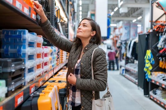 shopper-checking-shelf-in-hardware-store