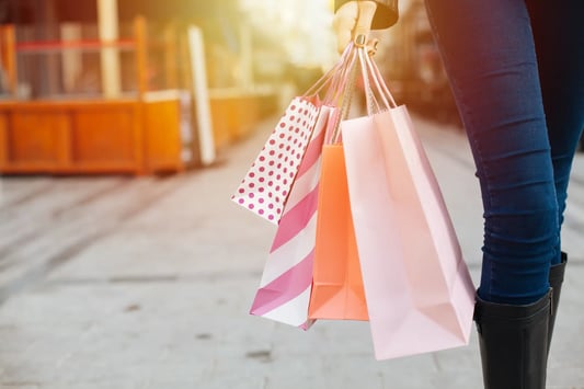 Woman shopping in a modern retail store, representing retail pricing strategy.