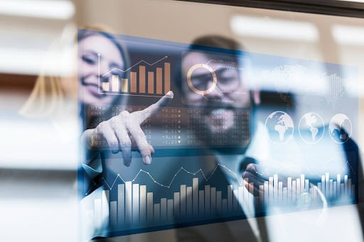 Retail professionals analyzing interactive dashboards with graphs and global data, showcasing how forecasting tools and software drive real-time insights, demand prediction, and inventory management through AI-powered forecasting and predictive analytics.