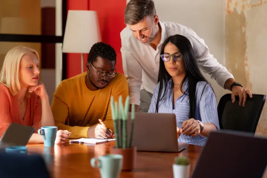 diverse team working on merchandise financial planning processes