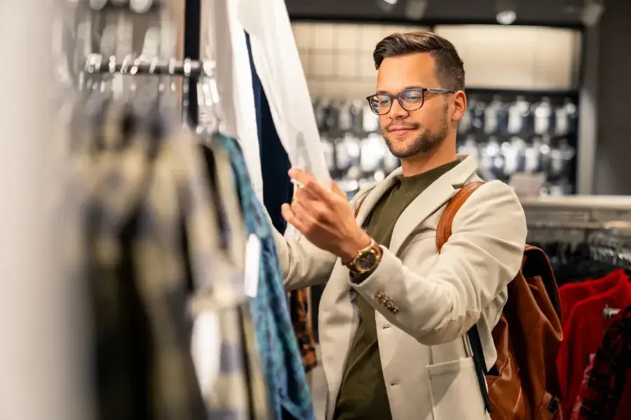 Male customer shopping in retail store, illustrating AI-driven assortment planning and retail analytics.