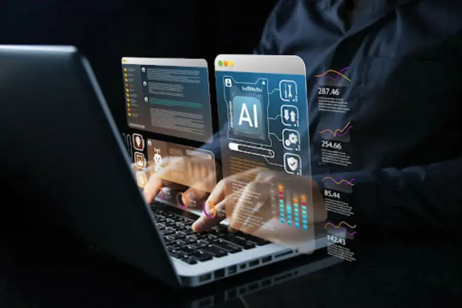 Person using a laptop with digital interfaces showing AI tools and data dashboards, symbolizing implementing agentic AI with autonomous agents, machine learning, NLP, and reinforcement learning to boost business efficiency, AI deployment, and enterprise integration.