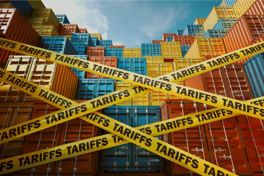 Stacks of colorful shipping containers blocked by yellow tape labeled 