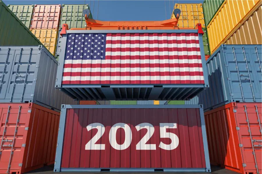 Shipping containers marked “2025,” with one painted as a U.S. flag, symbolize the impact of Trump tariffs and shifting trade tariffs on future global commerce.
