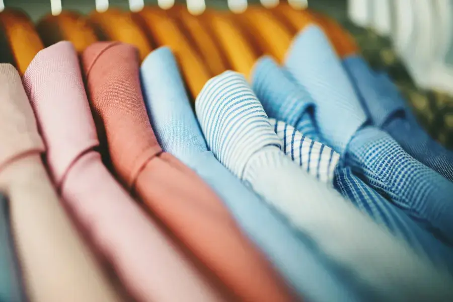 Shirts in varied colors and patterns represent how an inventory optimization solution keeps stock balanced by demand and location.