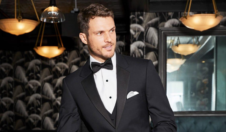 Man wearing a tuxedo representing AI-optimized formalwear rental business