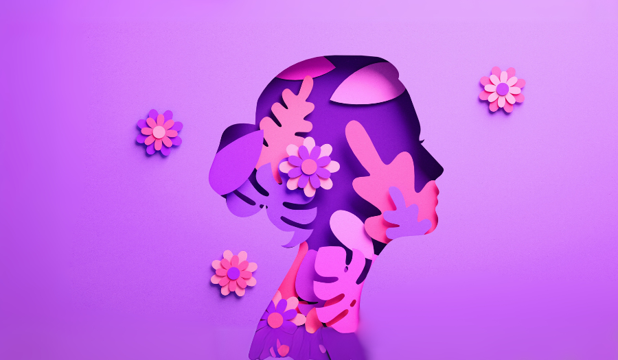 A vibrant woman with floral elements, symbolizing empowerment and leadership in retail for International Women’s Day.