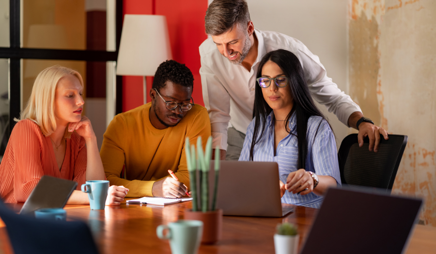 diverse team working on merchandise financial planning processes