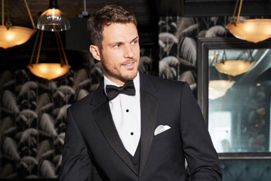 Man wearing a tuxedo representing AI-optimized formalwear rental business