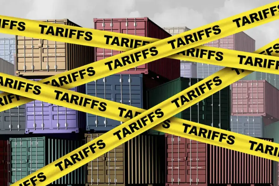 Shipping containers blocked by yellow 'Tariffs' tape, symbolizing the impact of tariffs on retail pricing and supply chain costs
