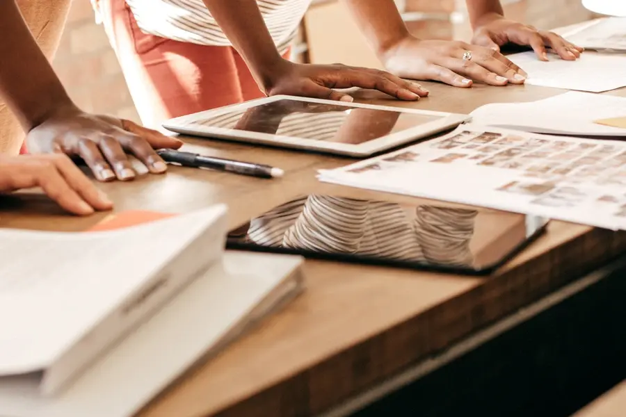 Retail buyers collaborating on retail planning and buy optimization strategies to manage data challenges in 2026.