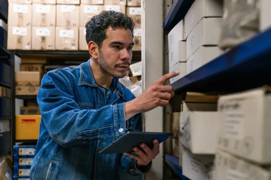 Retail employee managing inventory to optimize supply chain efficiency.